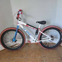 White Bmx Bike With Red And Blue Accents