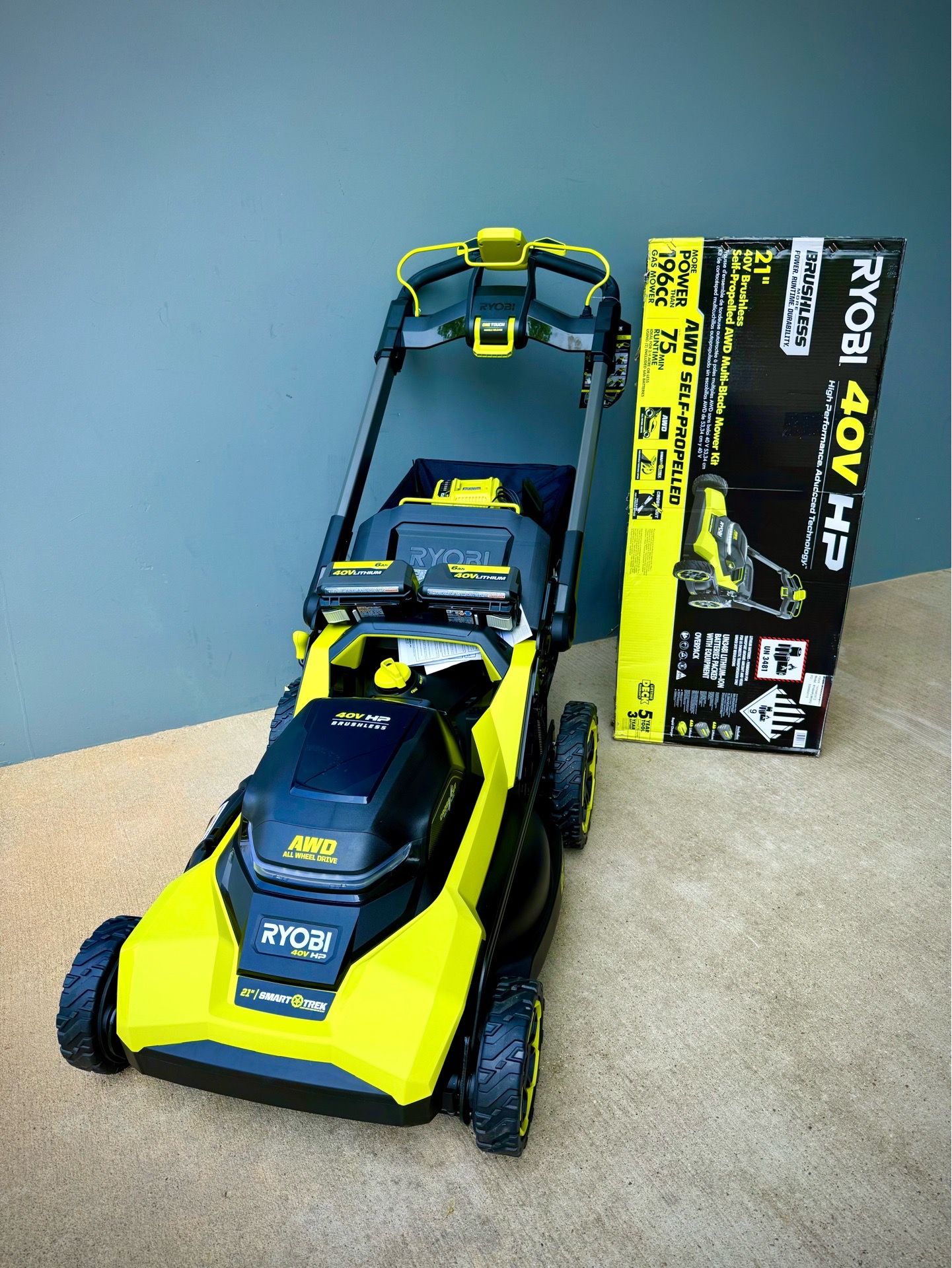 Brand new Ryobi 40V HP 21 in. Brushless Cordless Cross Cut Self-Propelled All Wheel Drive Mower w/ (2) 6.0 Ah Batteries & Charger