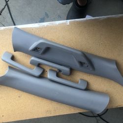 Interior left and right windshield trim with handle and three additional handles