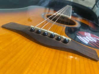6 string Mitchell acoustic guitar