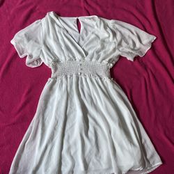 White babydoll dress with smocked waist and short sleeves 