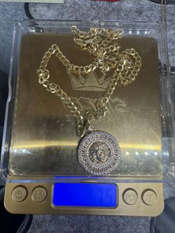 22” Chain an charm  14k 17.5 grams  