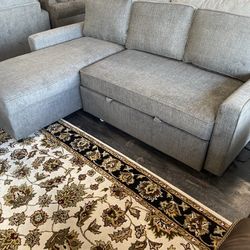 2 Piece Sectional With Pull Out Bed And Storage Chaise On Sale