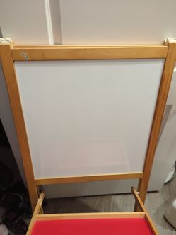 Kids standing white and black magnet board