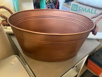 Round brass colored bucket