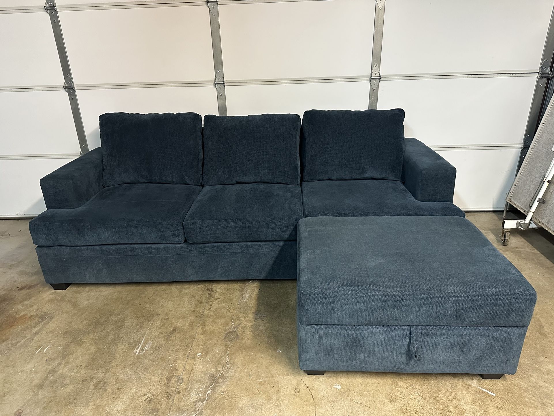 Living Spaces Blue Sectional Type Couch With Ottoman Storage Washable