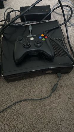 Xbox 360 with a controller and 10 games