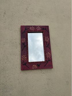 Framed wood mirror and decorations