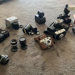 Lot of vintage Nikon, Minolta, Cannon cameras,filters and lenses (untested)