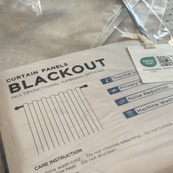 Two blackout curtain panels