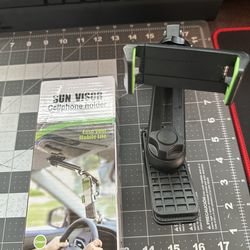 Sun visor phone holder