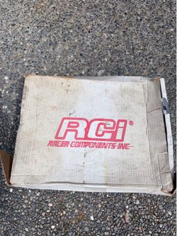 RCI 5-point latch and link racing harness in black.