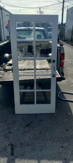Exterior solid wood single door with non impact glass approximately 36x79