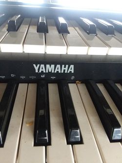 Trade for a riding lawn mower Electric Yamaha piano organ with a stool in excellent condition has two sets of keys top and bottom