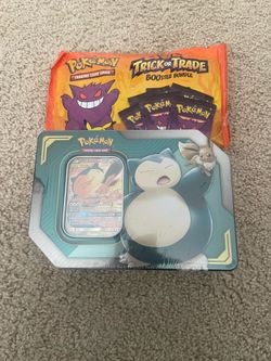Sealed Eevee and Snolax tin, and Trick or trade