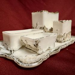 Rare Antique milk glass vanity set with gold trim.