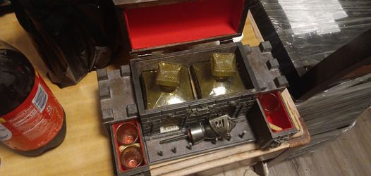 castle with two glass liquor bottles and four shot glasses