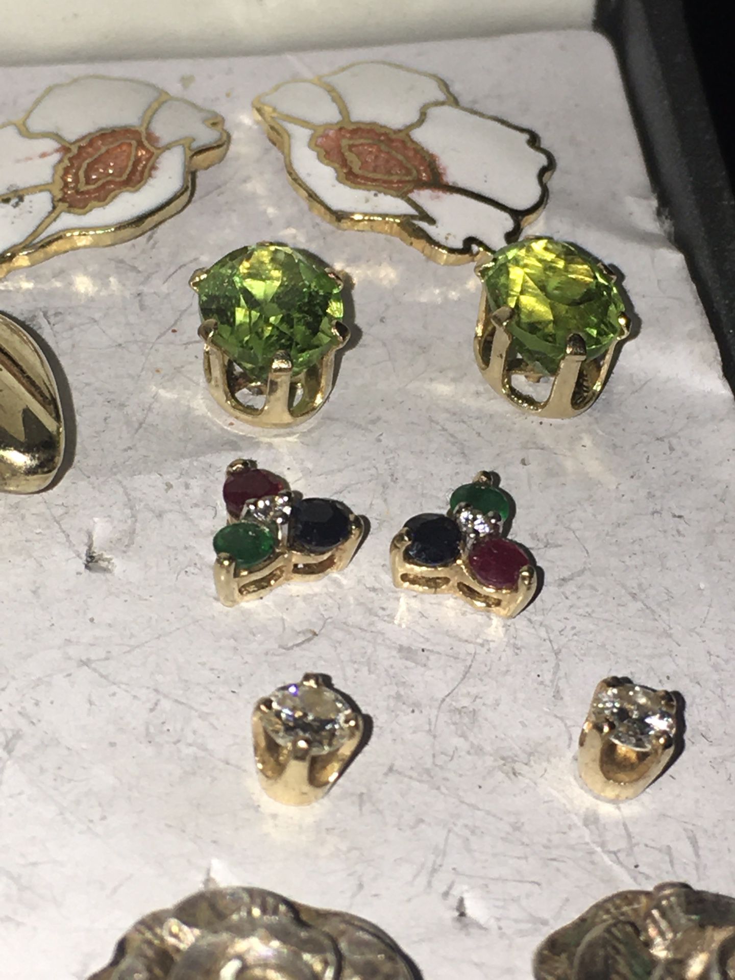 Real diamond, peridot, emerald, ruby, sapphire, gold, and pearl earrings