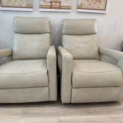 Two cream leather recliners