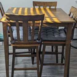 MOVE OUT SALE- Counter Height Dining Table With Four Chairs Plus Cushions - Pick Up Only
