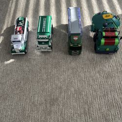4 Toy Trucks With Mini Cars