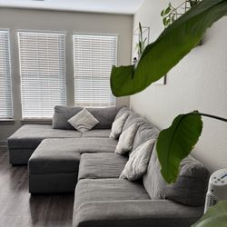 Three-piece fabric sectional couch with adjustable ottoman 