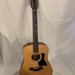 2015 Taylor 150e acoustic /electric guitar with hard case. 