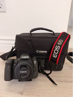 Canon Eos 6D DSLR Camera With 50 Mm Lens, Canon Battery, Battery Charger, Camera Bag And Accessories