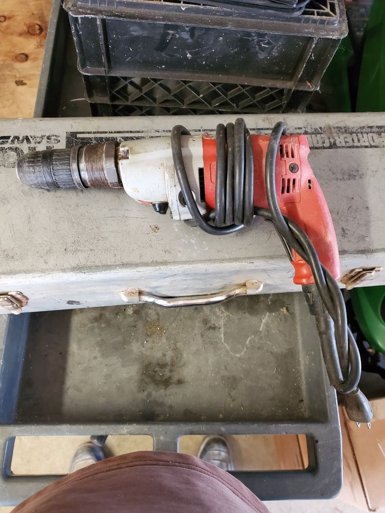 2 Milwaukee corded hammer drills