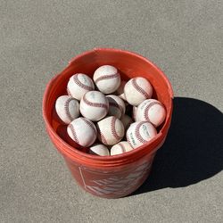 Bucket of 50 leather baseballs. $80