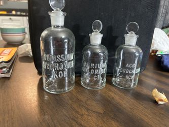 Antique apothecary raised letter bottles