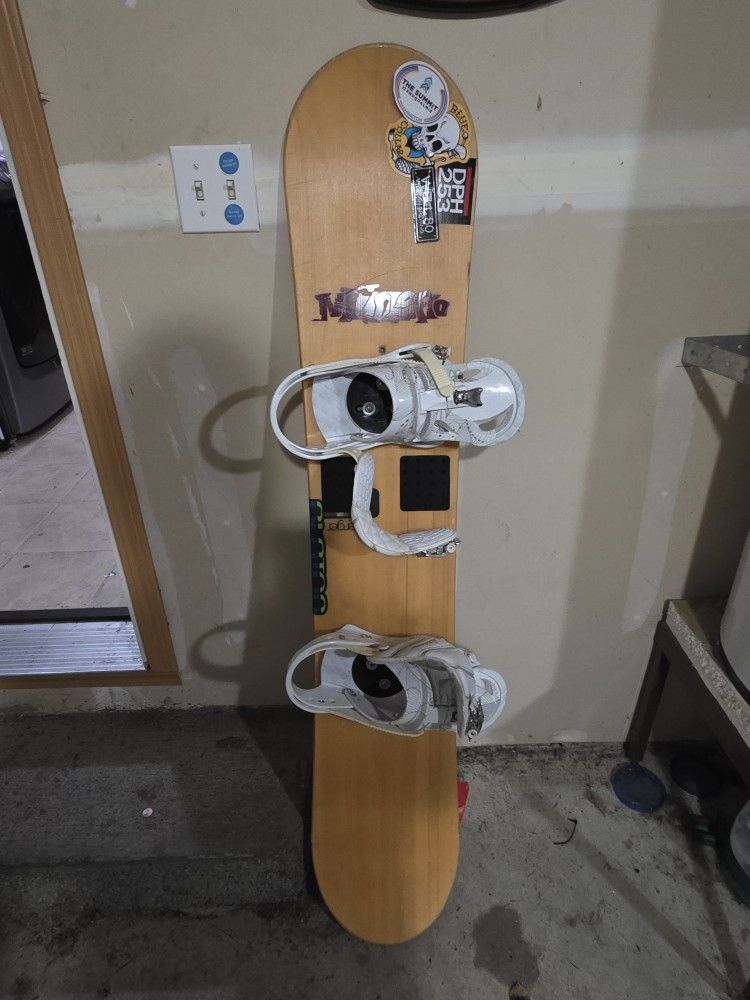 Burton snowboard and Ogio snowboard bag