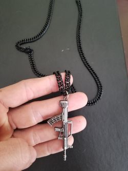 Stainless steel cuban chain (black) with gun pendant.