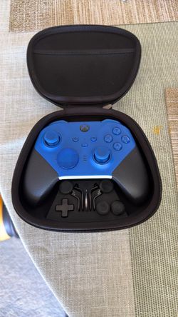 Xbox Elite series 2 controller with all components, charging cable with dock and carrying case.
