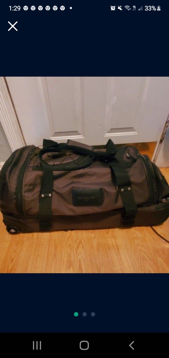 Samsonite Duffle bag...large Size ..with Wheels And Carry Strap..Good CONDITION 