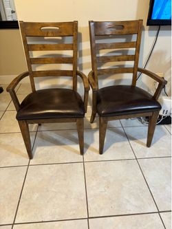 Pair of solid wood arm chairs