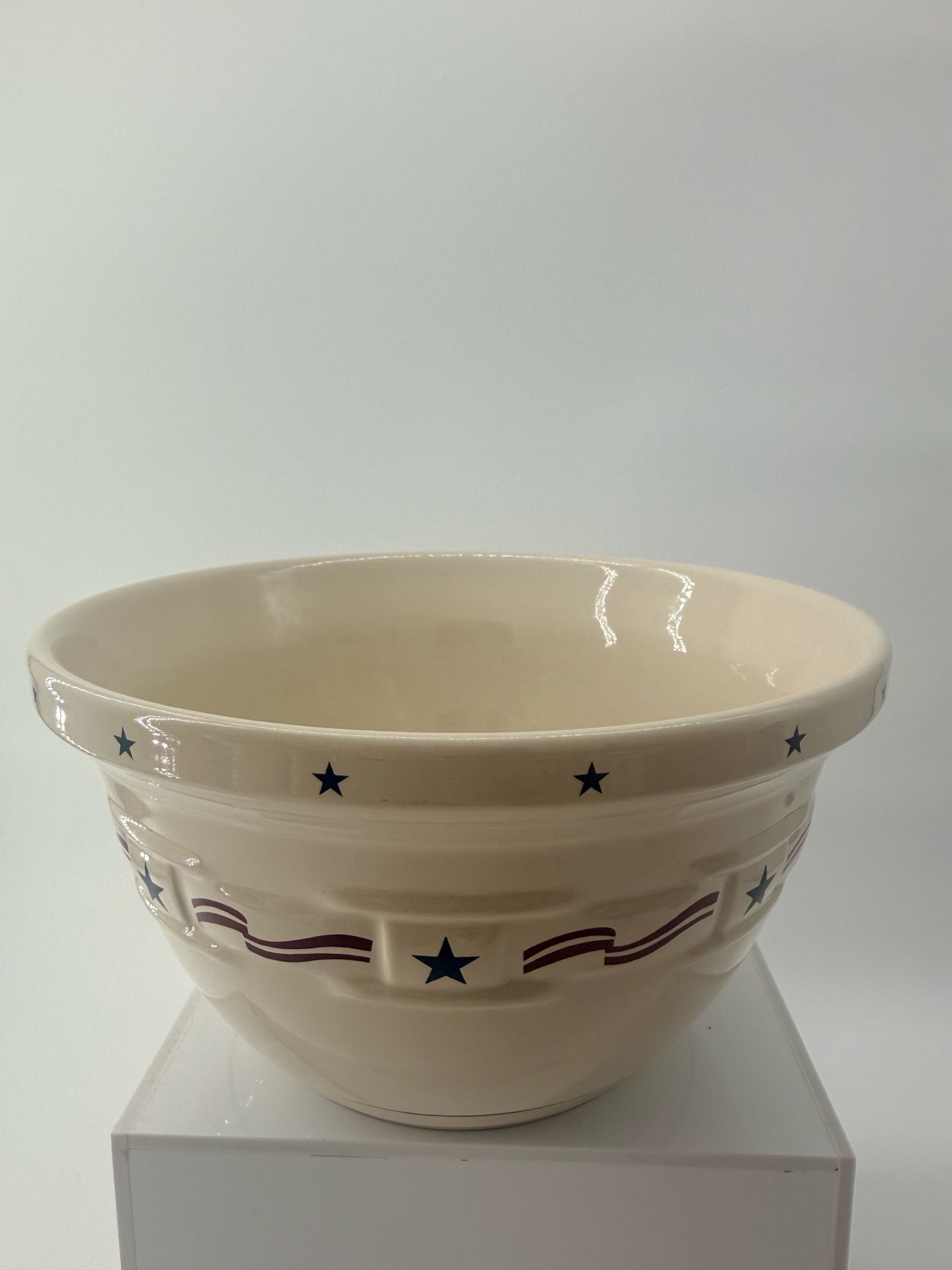 Longaberger pottery mixing bowl in the "All American" pattern.