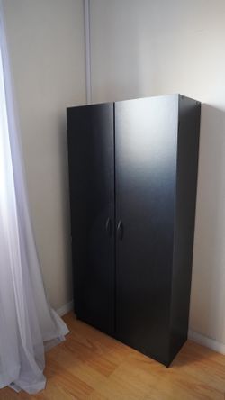 Black two-door book shelf or dresser