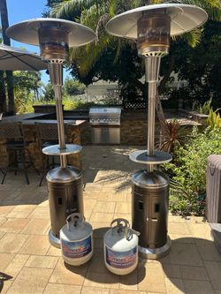 2 Propane Patio Heaters with adjustable table, heater covers and propane tanks!