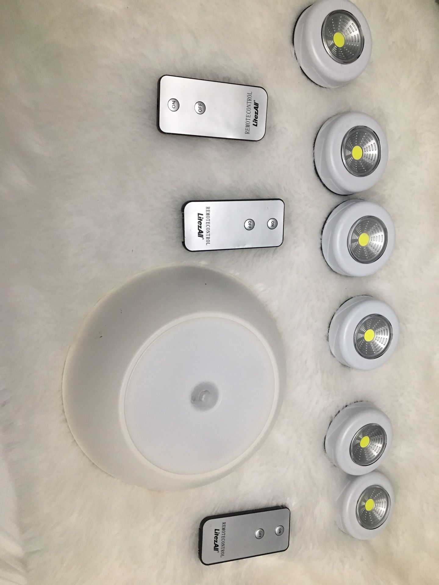 7 lights works with batteries also needs new batteries the large one is out door or in door Motion light can be use for garage patio or anywhere you