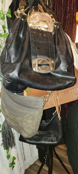 Several cute bags and wallets diff sizes and  brands