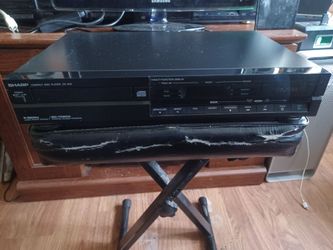 SHARP CD PLAYER WITH CDS LOT $140 FINAL PRICE READ DESCRIPTION AND SEE ALL PICTURES