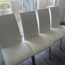 FREE MOVING SALE 4  White Dining Room Chairs With Stainless Steel Base Poor Condition Need To Be Reupholstered