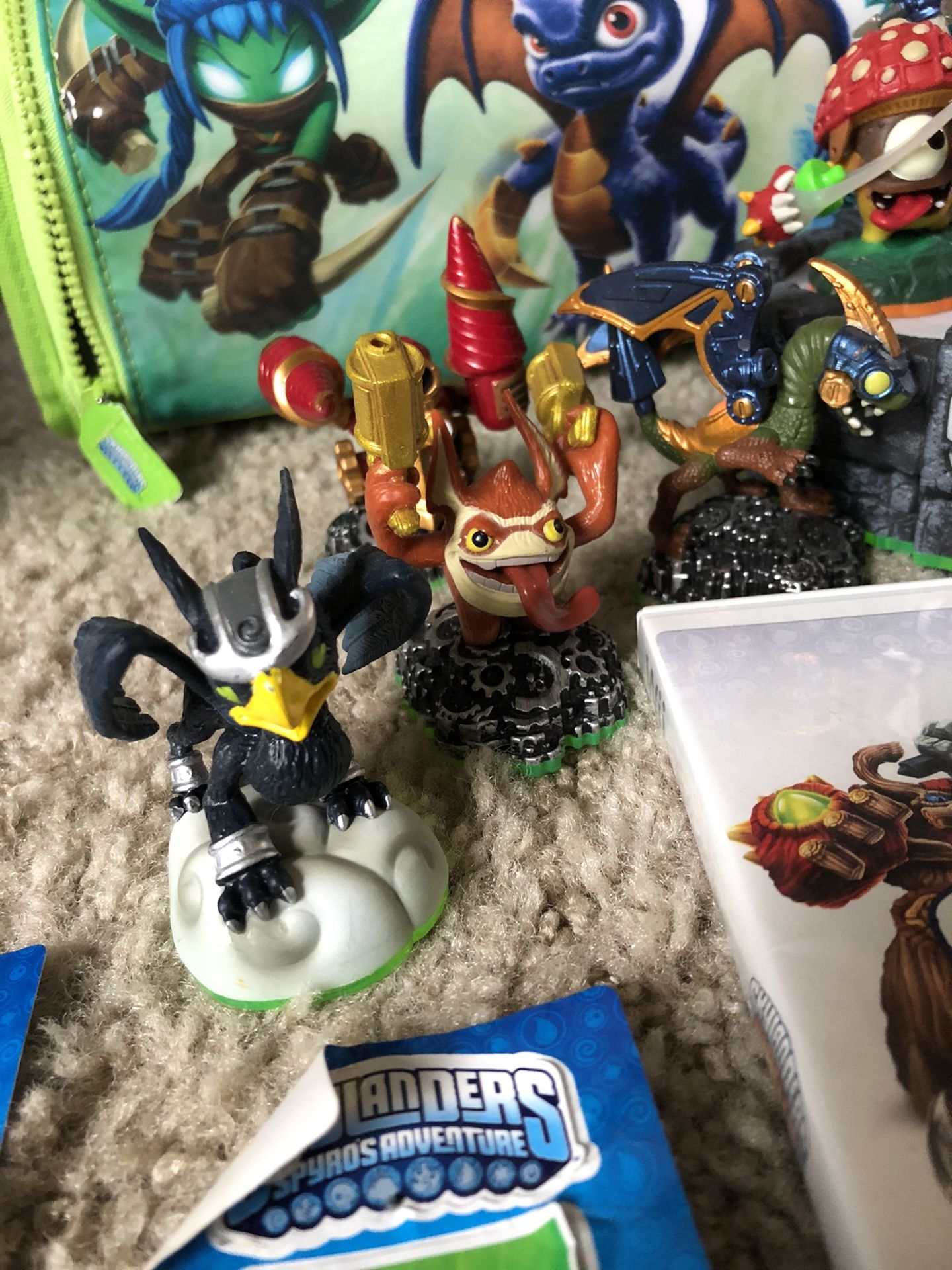 Skylander Wii games and 16 characters with carrying case