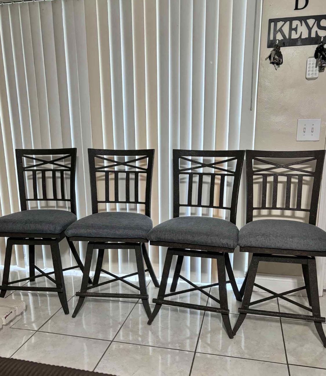 4 Wrought-Iron Swivel Bar Stools
