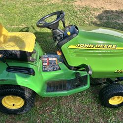 Lx255 Mower With Plow And Bagger. 