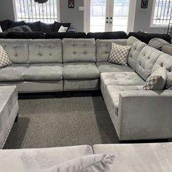Grey Fabric Sectional. Brand New.