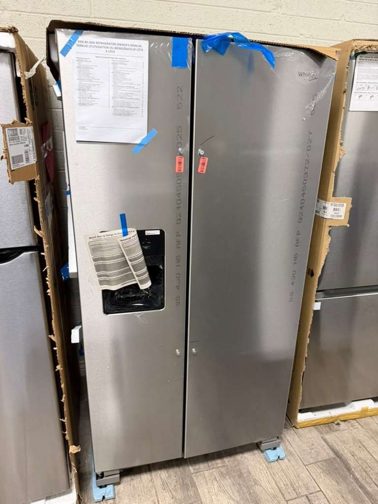 Whirlpool stainless steel side by side refrigerator brand new with warranty