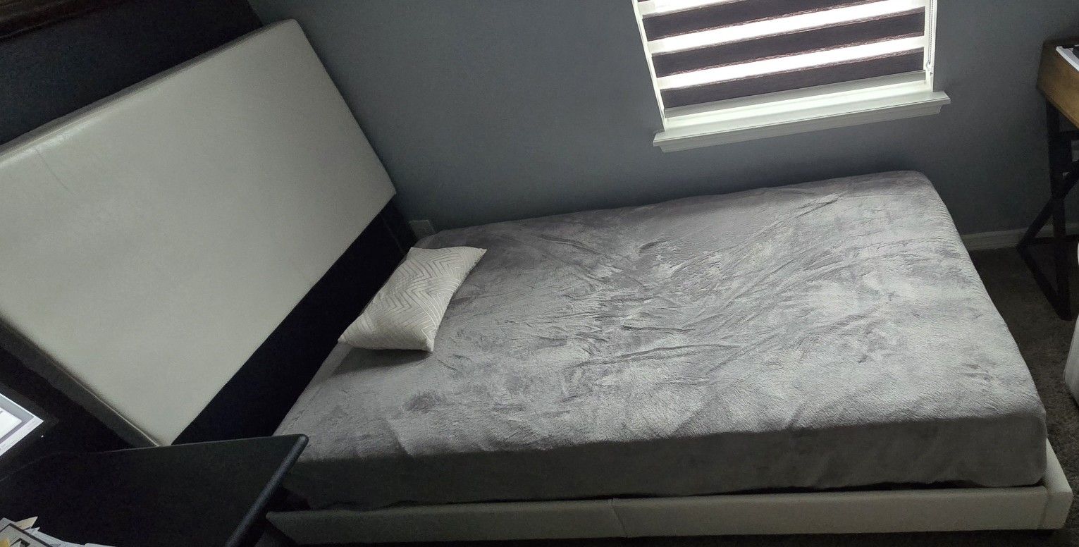 Twin bed frame with headboard and mattress