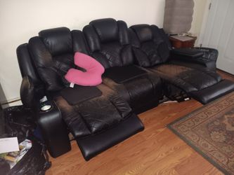 Dark Brown leather 3 seater sofa with double reclyne.$300 OBO